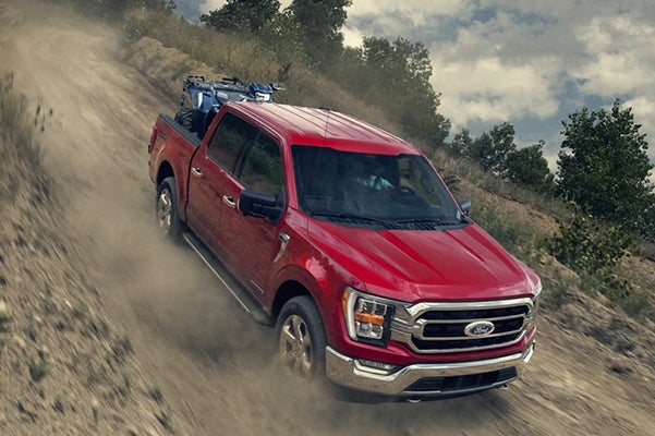 2021 Ford F-150 driving through dirt road