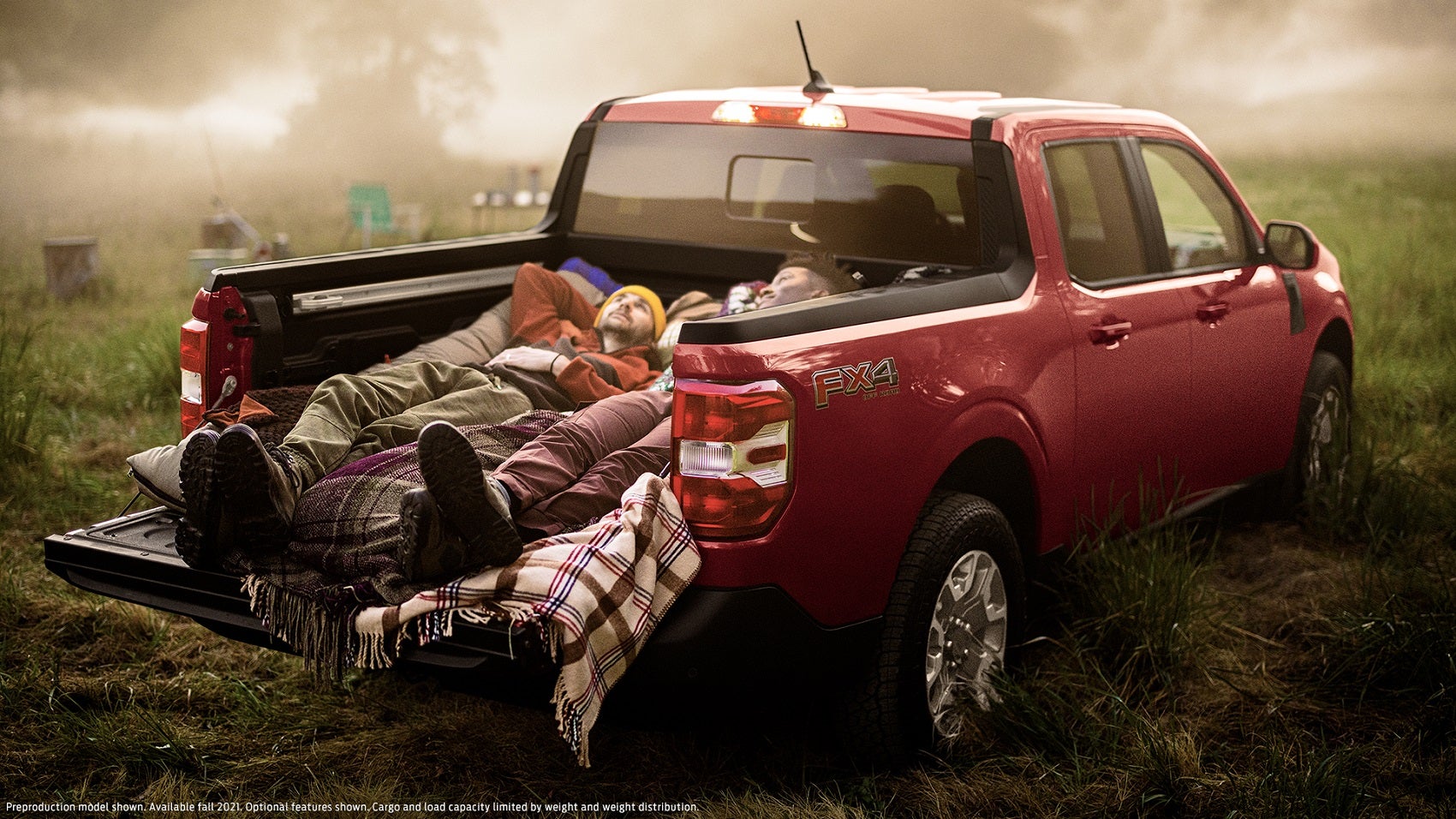 People laying in bed of Maverick looking at sky