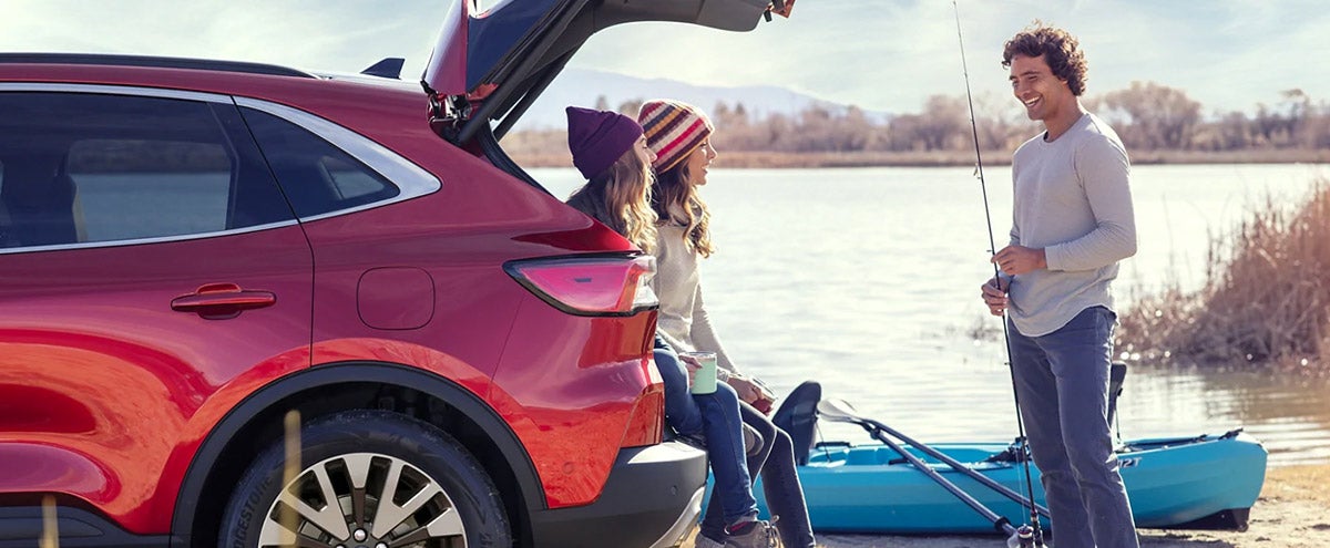 Friends hanging out in the back of a Ford Escape