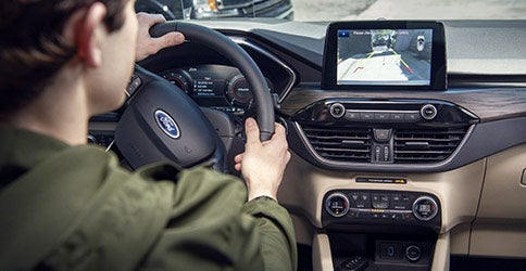 Driver using rear camera screen