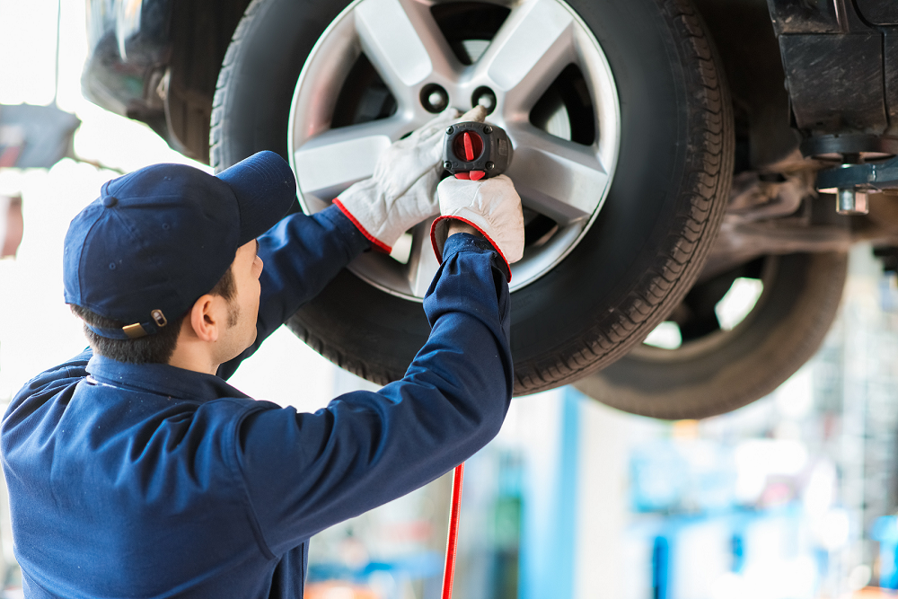 Service tech replacing tires